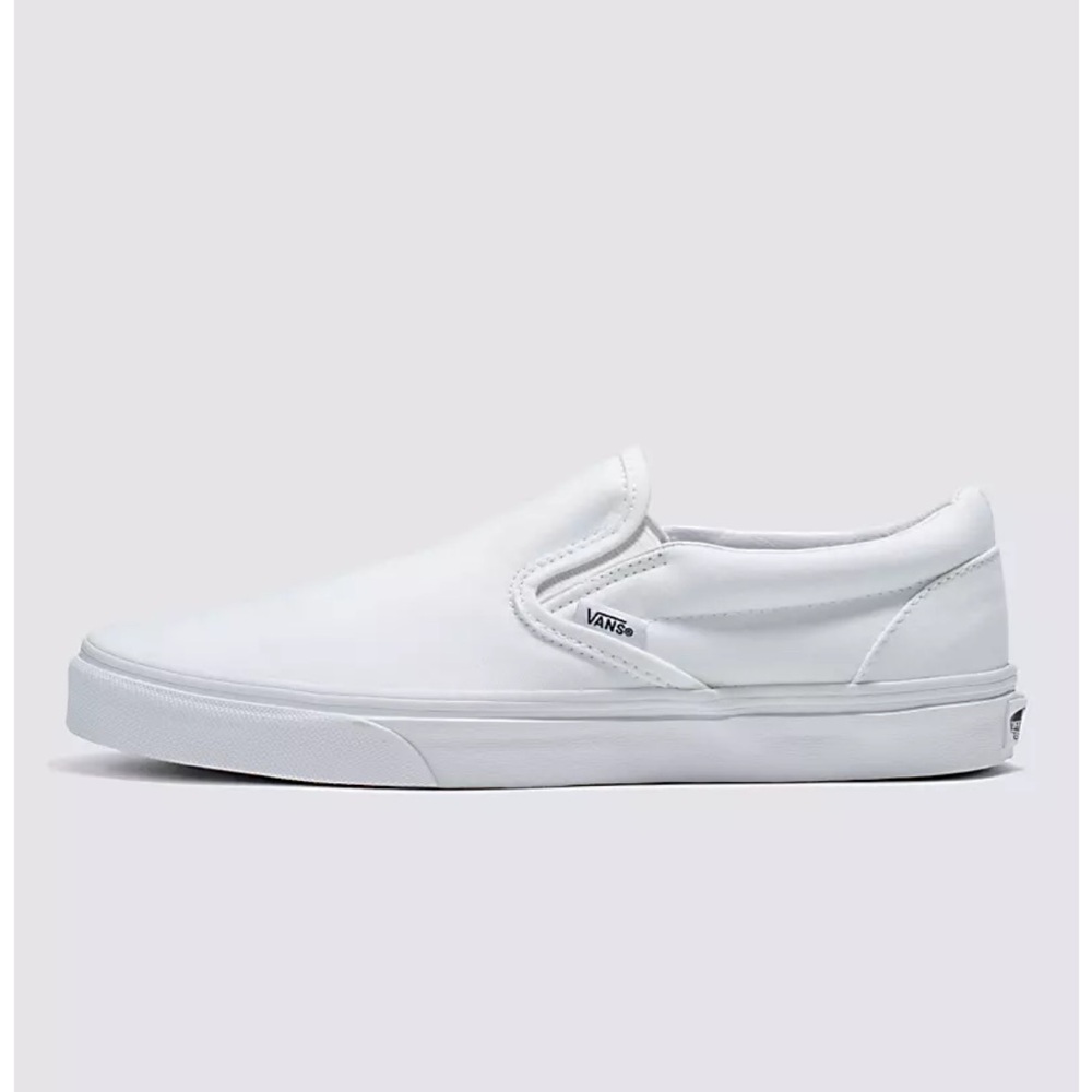 White Vans slip ons.